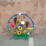Bicycle wheel decorated with plant life to celebrate the AMGEN Tour of California